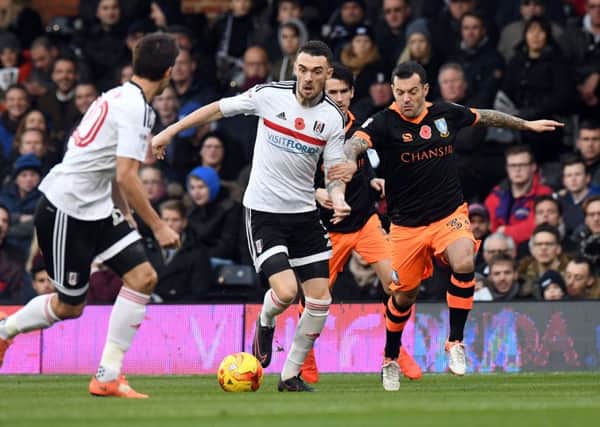 Fulham's Scott Malone battles with Sheffield Wednesday's Ross Wallace last season. Picture: Victoria Jones/PA