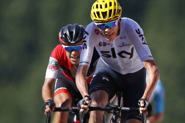 New overall leader Britain's Chris Froome, right, and Australia's Richie Porte grimace in the last few yards of the fifth stage of the Tour de France. Picture: AP/Peter Dejong