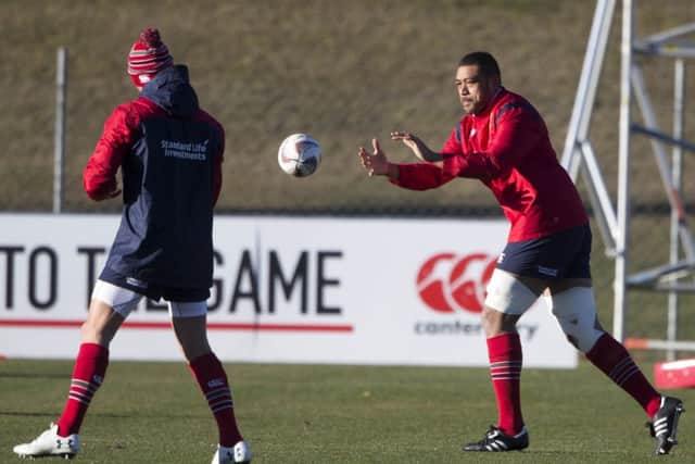 British and Irish Lions loose forward Taulupe Faletau, right, passes the ball during a training session in Queenstown. Picture: Brett Phibbs/New Zealand Herald/AP.