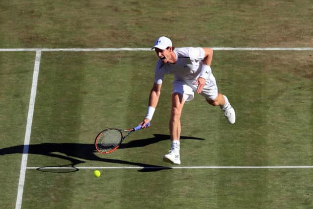 Andy Murray stretches to reach a drop shot from Dustin Brown. Picture: Adam Davy/PA