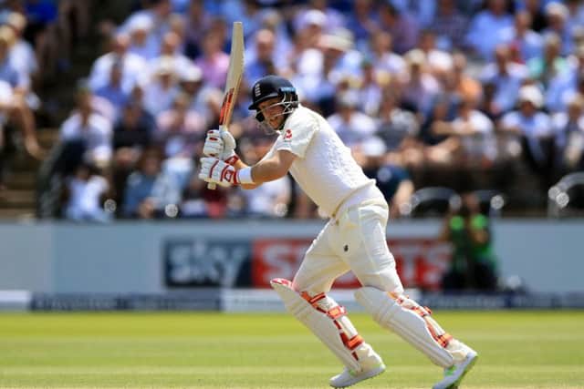 England's Joe Root pushes the ball through the leg side on a perfect start to life as England captain. Picture: Nigel French/PA