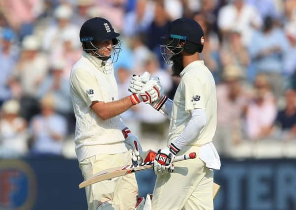 Mooen Ali congratulates England captain Joe Root on reaching 150 in the Yorkshiremans first innings in charge of the Test team (Picture: Nigel French/PA Wire).
