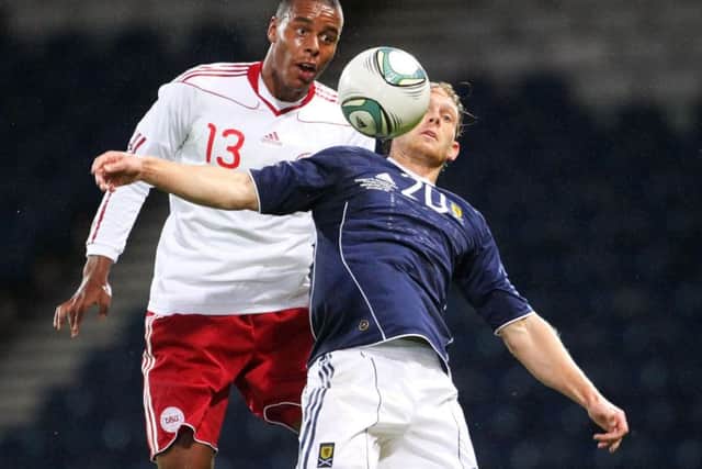 Mathias Jorgensen (left), in action for Denmark against Scotland. Picture: Lynne Cameron/PA