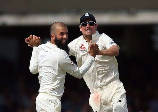 England's Moeen Ali celebrates the wicket of South Africa's Dean Elgar with Alastair Cook (Picture: Nigel French/PA Wire).