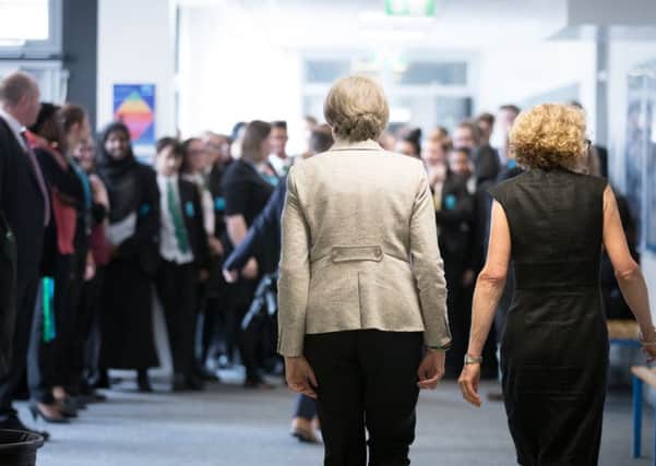 Theresa May during a recent school visit, but did she learn any lessons about public sector pay?