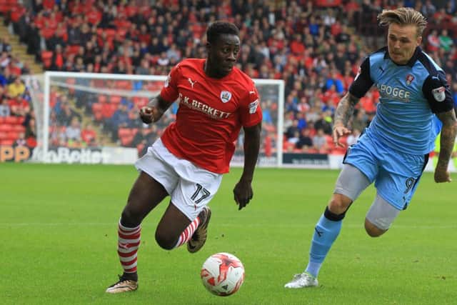 Barnsley's Andy Yiadom, left. Picture: Chris Etchells