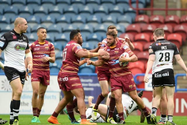 Shannon Wakeman celebrates scoring Huddersfield Giants' first try against Widnes Vikings.  Picture: Bruce Rollinson