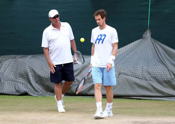 SHOWTIME: Andy Murray speaks with his coach Ivan Lendl during a training session on Sunday at Wimbledon. Picture: Steven Paston/PA