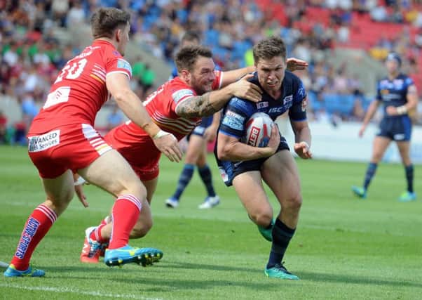 Rhinos' Matt Parcell bursts through to score a try.  Picture Tony Johnson.
