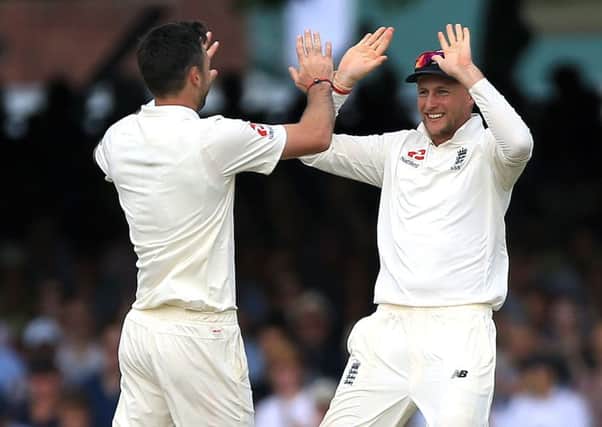 Yorkshires Joe Root, captaining England for the first time, congratulates James Anderson after the bowler took the wicket of South Africas Heino Kuhn in the first Test at Lords (Picture: Nigel French/PA Wire).