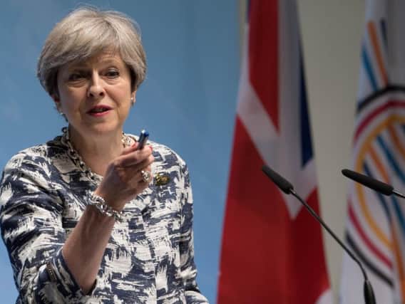 Theresa May said at the G20 summit she would be playing a "full part" in future international meetings suggesting she is determined to remain in office.