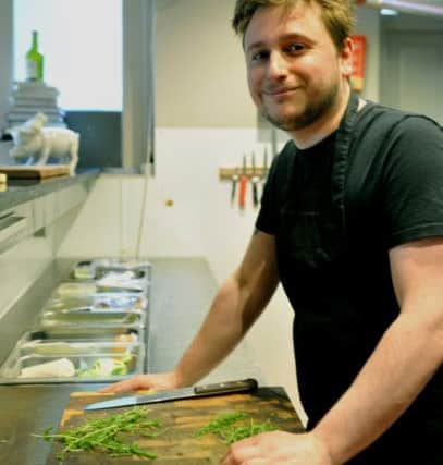 Chef Josh Overington working  in the kitchen at Le Cochin Aveugle in York where the Chefs Tomorrow event is being held on Monday