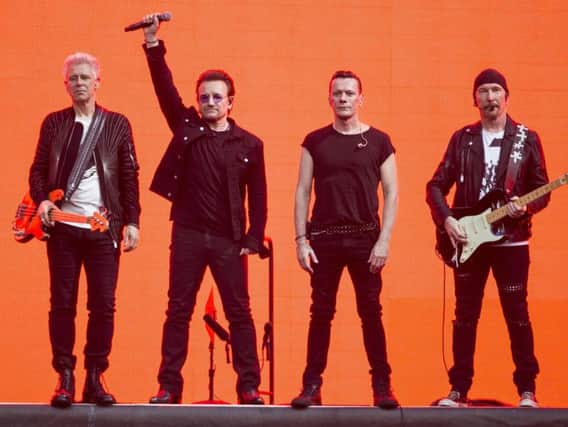 Musicians, Adam Clayton, from left, Bono, Larry Mullan Jnr and The Edge, of the band U2, performed on stage at Twickenham Stadium in London at the weekend. (Photo by Joel Ryan/Invision/AP)