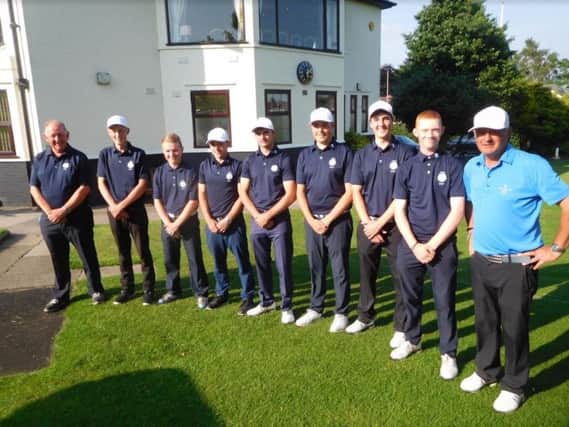 Yorkshire Boys, pictured after their Northern Counties triumph with manager Philip Woodcock, left, and England Golf coach of the Year Steve Robinson, right.