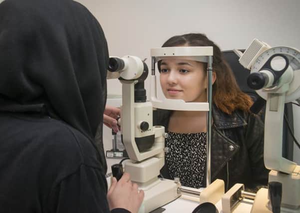 Niamh Kane, 14, having her eyes checked at Vision Express in Sheffield