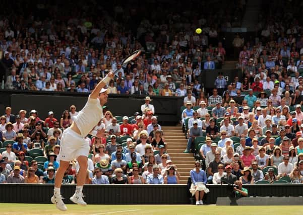 Andy Murray serves against Benoit Paire at Wimbledon. Picture: Adam Davy/PA