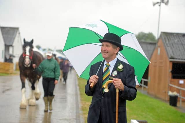 Great Yorkshire Show director Charles Mills in the rain at the start of the first day.  Picture by Tony Johnson.