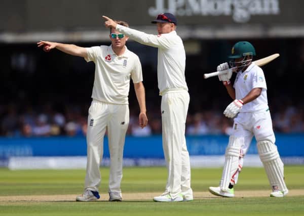 Liam Dawson discusses fielding positions with England captain Joe Root, centre, during the first Test against South Africa.