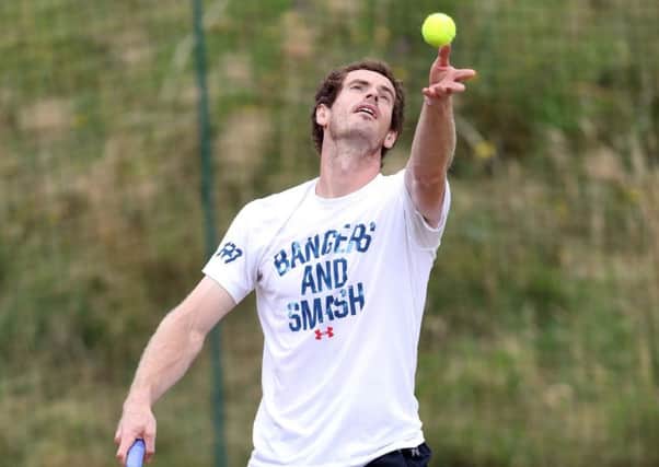 Andy Murray practises his serve during a training session with coach Ivan Landl at Wimbledon yesterday. The champion today faces Sam Querrey in the last eight (Picture: John Walton/PA Wire).