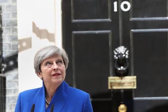 Theresa May on the mroning after the June 8 election, but can she stay in office?