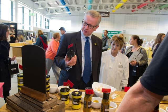 Mr Gove browses at the Yorkshire Rapeseed Oil stand.