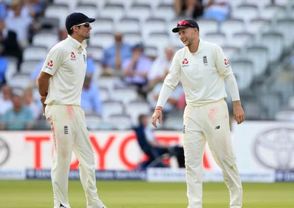 England's captain Joe Root (right) with Alastair Cook during the first Test against South Africa.