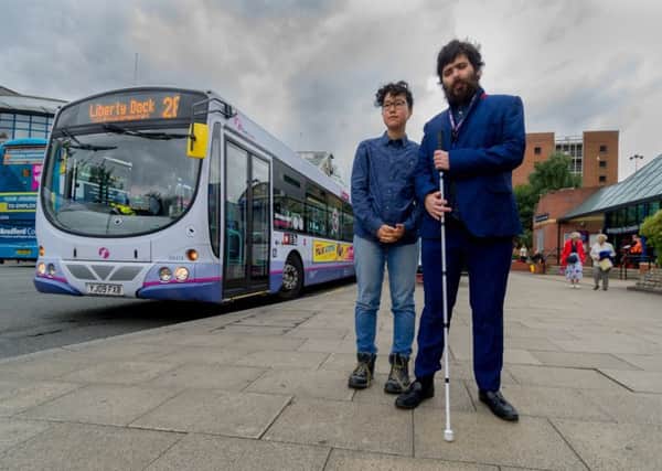 Date: 21st July 2017.
Picture James Hardisty.
Masami Hirata-Smith, 22, and Peadar O'Dea, 25, students at Leeds University, having started an online petition at First Bus to make buses in Leeds more accessible for all disable people, pictured outside Leeds Bus Station.