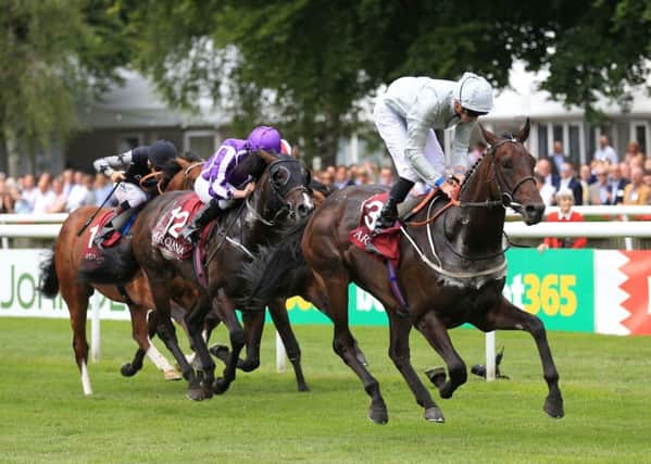 Cardsharp (right) ridden by Jamie Doyle wins The Arqana July Stakes at Newmarket. Picture: Nigel French/PA Wire