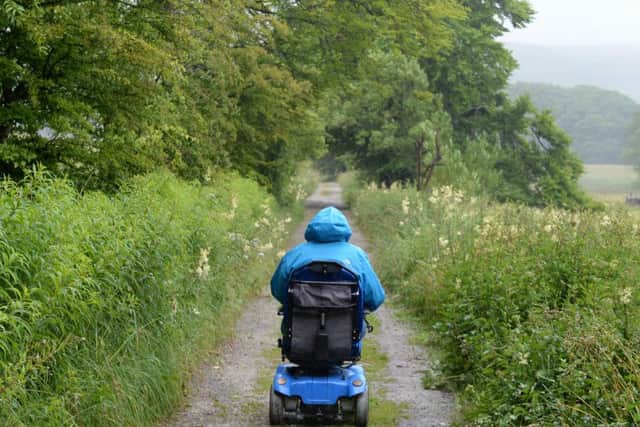 Debbie North who is campaigning for more disabled people to be able to enjoy the beauty of the Yorkshire Dales through the use of special all-terrain wheelchairs. pictured at Malham Tarn, where Debbie has helped fundraise for an all-terrain wheelchair to be in place at the National Trust property.
10 July 2017.  Picture Bruce Rollinson