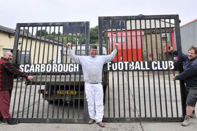 The old Scarborough FC gates are removed from the old Seamer Road ground by Boro fans Dave Morgan,Dave Hunter and Kevin MatthewsPicture: Richard Ponter 162619a