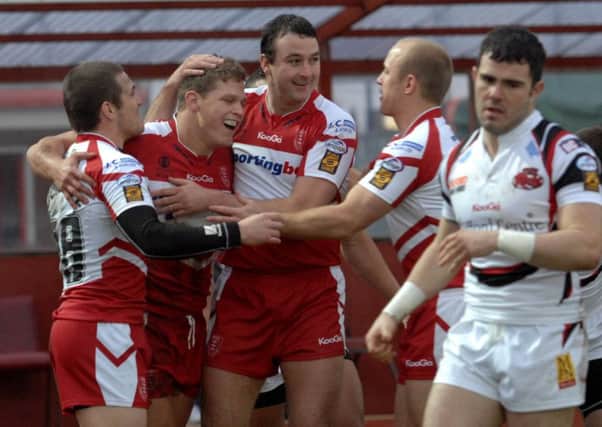 Peter Fox is contratulated for scoring a try for Hull KR. Picture: Terry Carrott