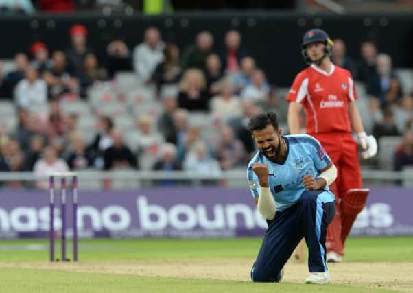 Azeem Rafiq celebrates taking Jos Buttler's wicket for 28. Picture: Bruce Rollinson.