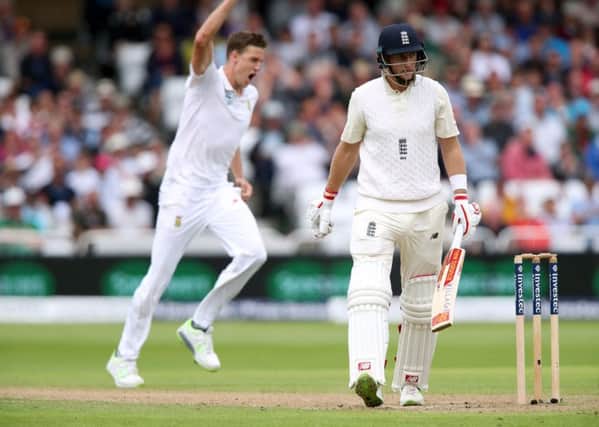 South Africa's Morne Morkel (left) celebrates taking the wicket of England's Joe Root. Picture: Nick Potts/PA