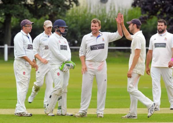 Stuart Hudson of  Beckwithshaw is congratulated after getting another Pool wicket