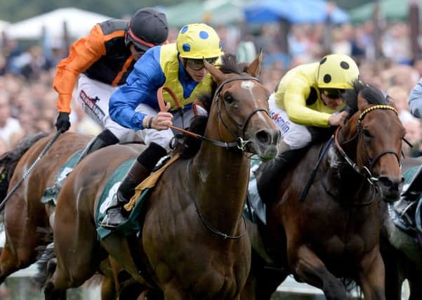 Ballet Concerto ridden by James Doyle (left) wins the 58th John Smiths Cup during day two of the John Smith's Cup Meeting at York Racecourse. (Picture: Anna Gowthorpe/PA Wire)
