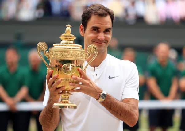 Roger Federer celebrates a record eighth Wimbledon men's singles title by beating Croatian Marin Cilic 6-3 6-1 6-4. Picture: Adam Davy/PA