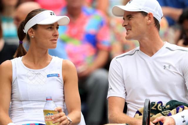 Martina Hingis and Jamie Murray discuss tactics during the mixed doubles final against Heather Watson and Henri Kontinen. Picture: Adam Davy/PA