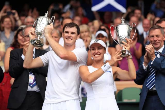 Martina Hingis and Jamie Murray celebrate victory in the mixed doubles final against Heather Watson and Henri Kontinen. Picture: Adam Davy/PA