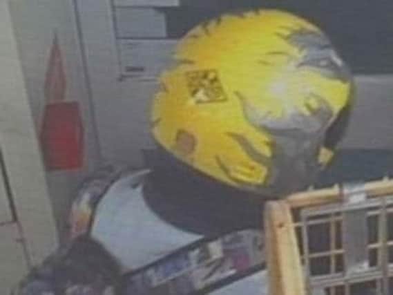 Police issue CCTV image of distinctive helmet.