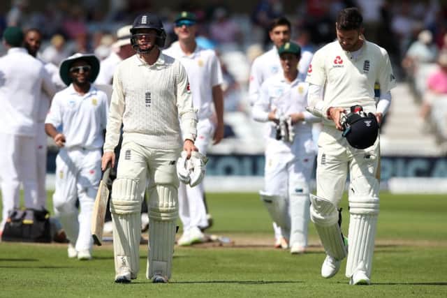 England's Liam Dawson (left) and James Anderson walk off after the last wicket falls against SOuth Africa at Trent Bridge. Picture: Nick Potts/PA