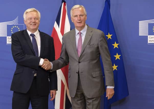 EU chief Brexit negotiator Michel Barnier, right, poses with British Secretary of State David Davis