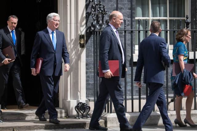 (left to right) International Trade Secretary  Liam Fox, Defence Secretary Sir Michel Fallon, Transport Secretary  Chris Grayling, Chief Whip Gavin Williamson and Leader of the House of Lords Baroness Evans of Bowes leave following a cabinet meeting in Downing Street, London. PRESS ASSOCIATION Photo. Picture date: Tuesday July 18, 2017. Photo credit should read: Stefan Rousseau/PA Wire