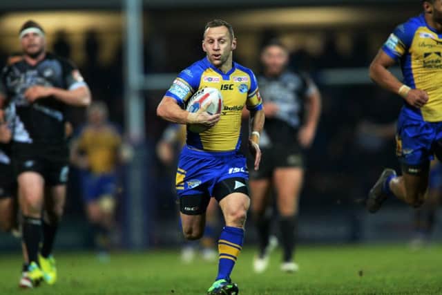 Rob Burrow charges for the line to score atry against Catalans Dragons.  Picture: Bruce Rollinson