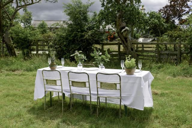 Garden party time with industrial-style chairs, vintage planters and Hungarian pickle jars as vases