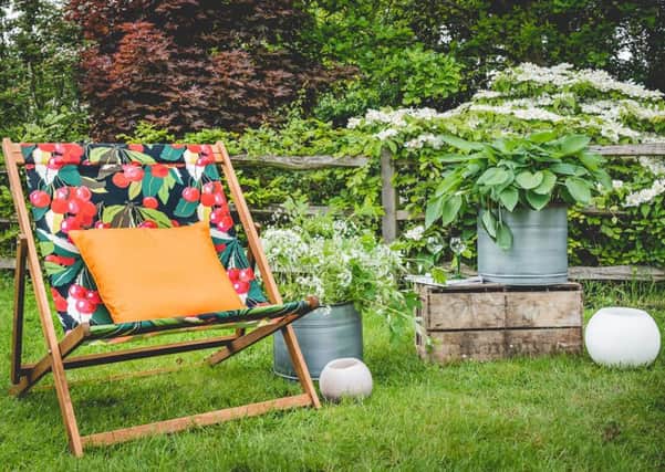 Time spent in the garden could be spent spotting property maintenance issues, says Tim Waring. Picture: extra large deckchair, Â£195, denysandfielding.co.uk