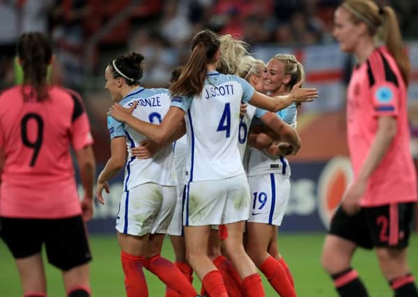 England's Toni Duggan (centre right) celebrates scoring her side's sixth goal.