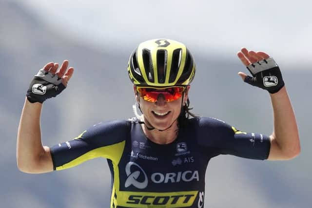 Annemiek van Vleuten, of the Netherlands celebrates as she crosses the finish line to win the first stage of La Course by Le Tour de France. Picture: AP/Christophe Ena.
