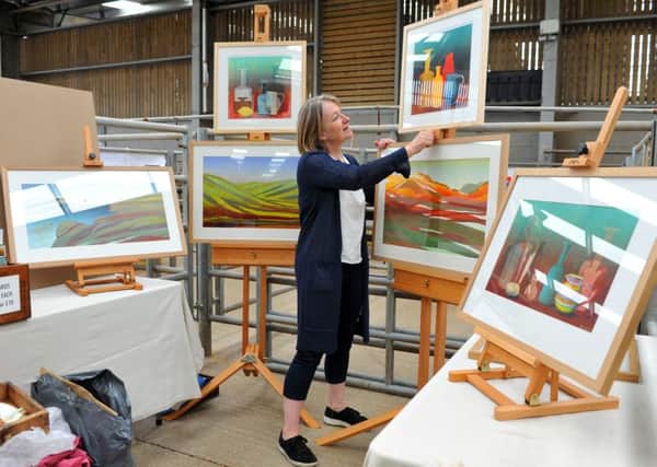 Sarah du Feu from Barnsley sets up her stall for Art in the Pen at Thirsk Auction Mart this weekend. PIC: Tony Johnson
