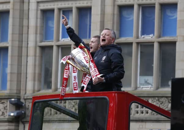 MAGIC MOMENTS: Sheffield United manager Chris Wilder, seen, celebrating aboard the open-top bus parade the club enjoyed through the Steel City after winning the League One title last season. Picture: Simon Bellis/Sportimage