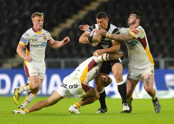 Danny Washbrook of Hull FC is tackled
